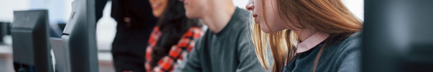 Everyone doing his work. Group of young people in casual clothes in the modern office.
